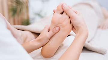 Physiotherapist providing foot therapy